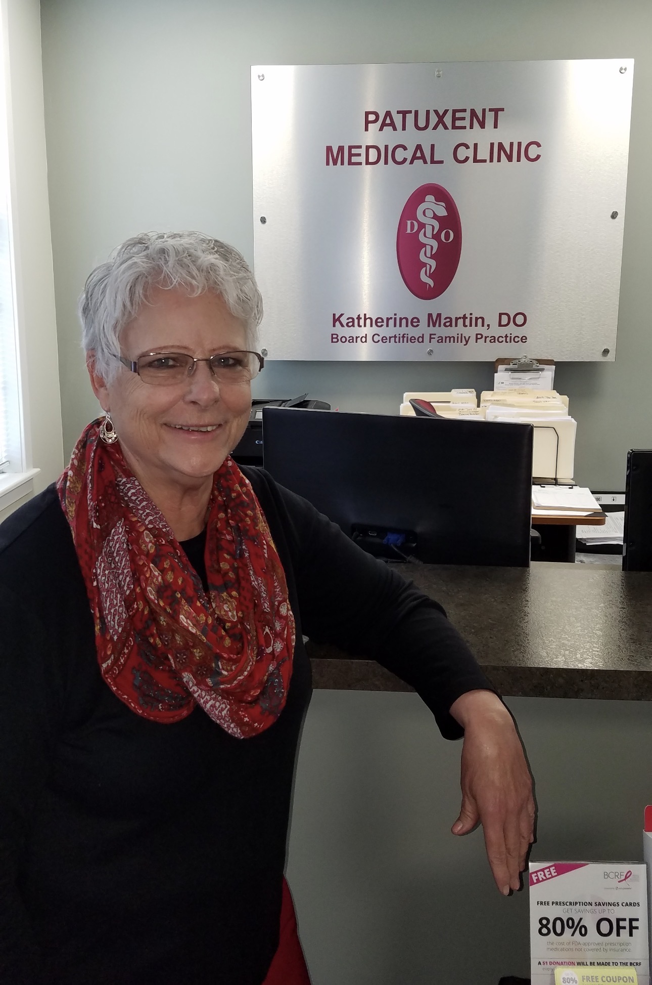 Dr. Katherine Martin at the clinic reception desk